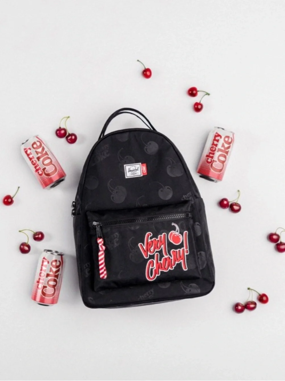Herschel Supply Company Black Mini Backpack with Red Cherry Coke Tag